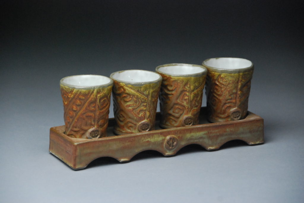 Vince Pitelka, Whiskey Cups with Stand, 2020, slab-built white stoneware, soda-fired to cone-7