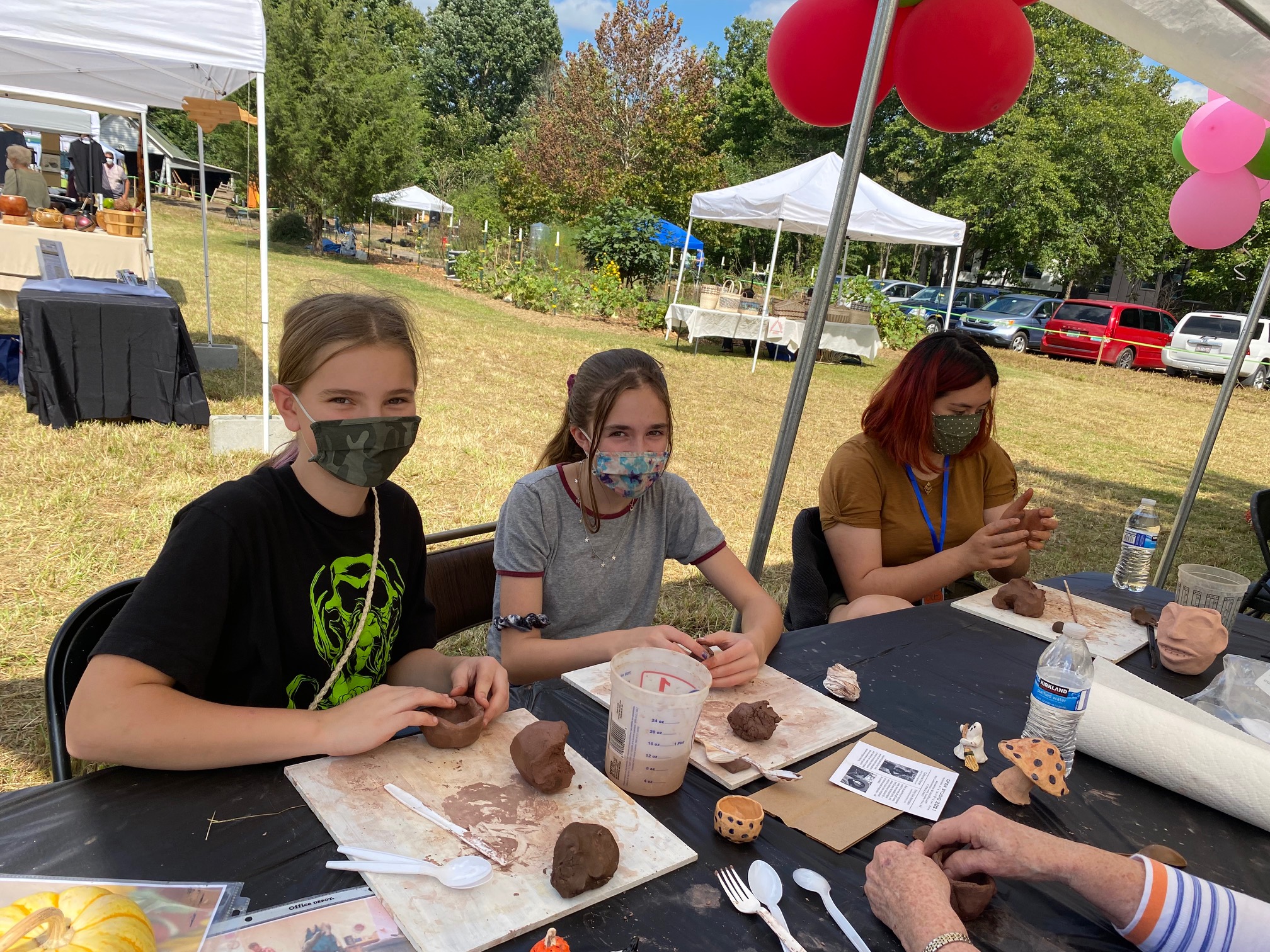 Participants Making Clay Pinch Pots - CAG-CCM Art Booth - Fall 2021
