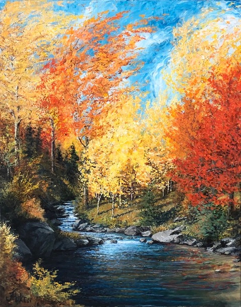 Autumn Landscape of colorful fall trees in red and gold oboe a winding stream